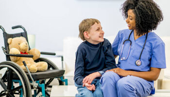 A child with special needs due to chromosome 8P inversion duplication syndrome with a doctor.